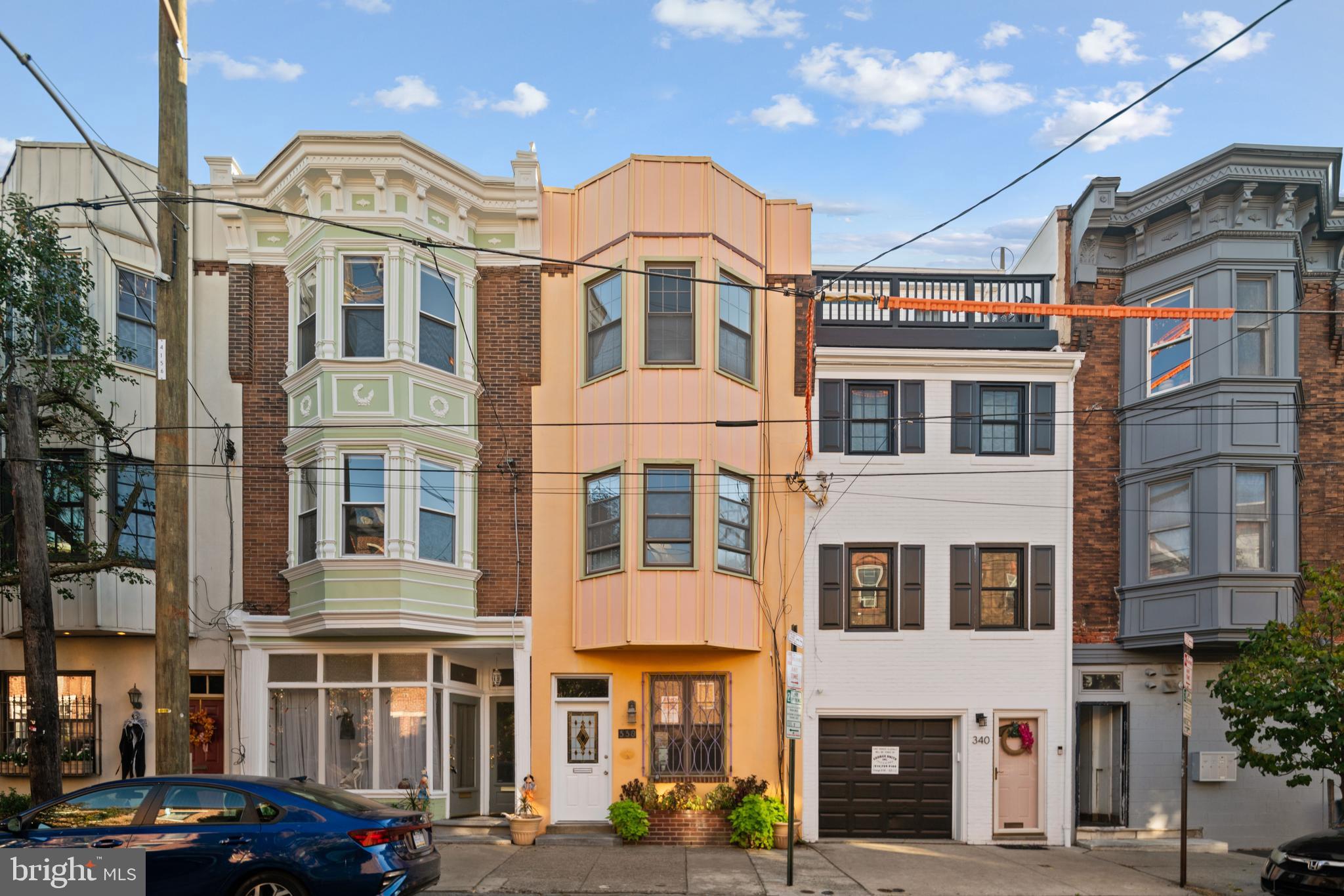 a front view of a residential apartment building with a yard