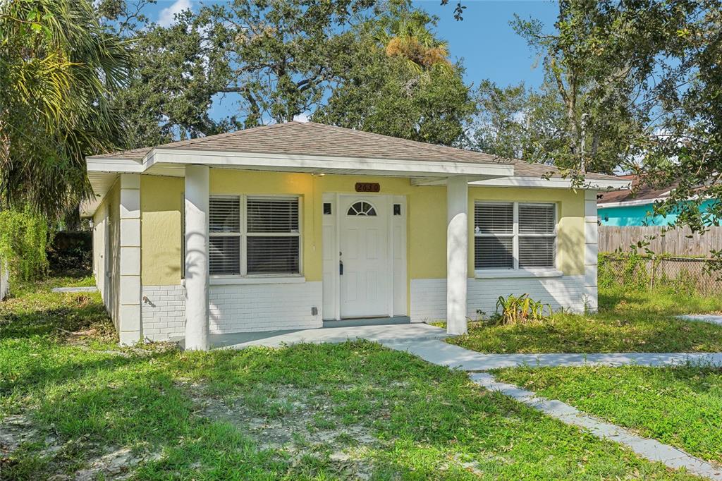 front view of a house with a yard