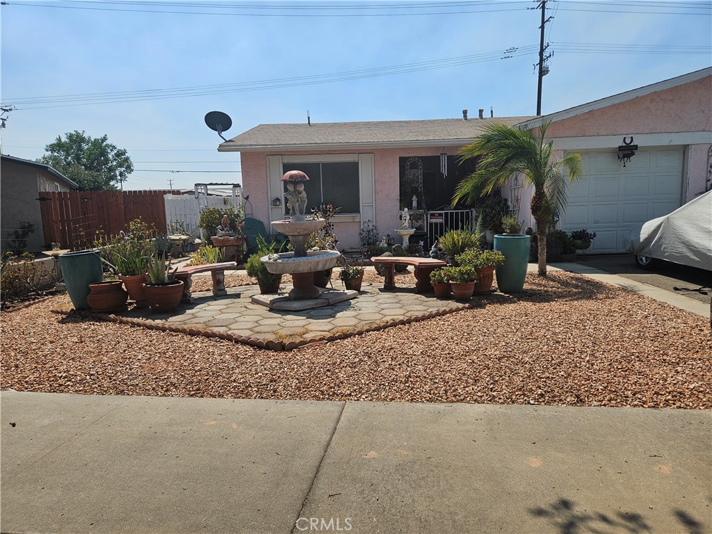 Covered front patio with gated entry