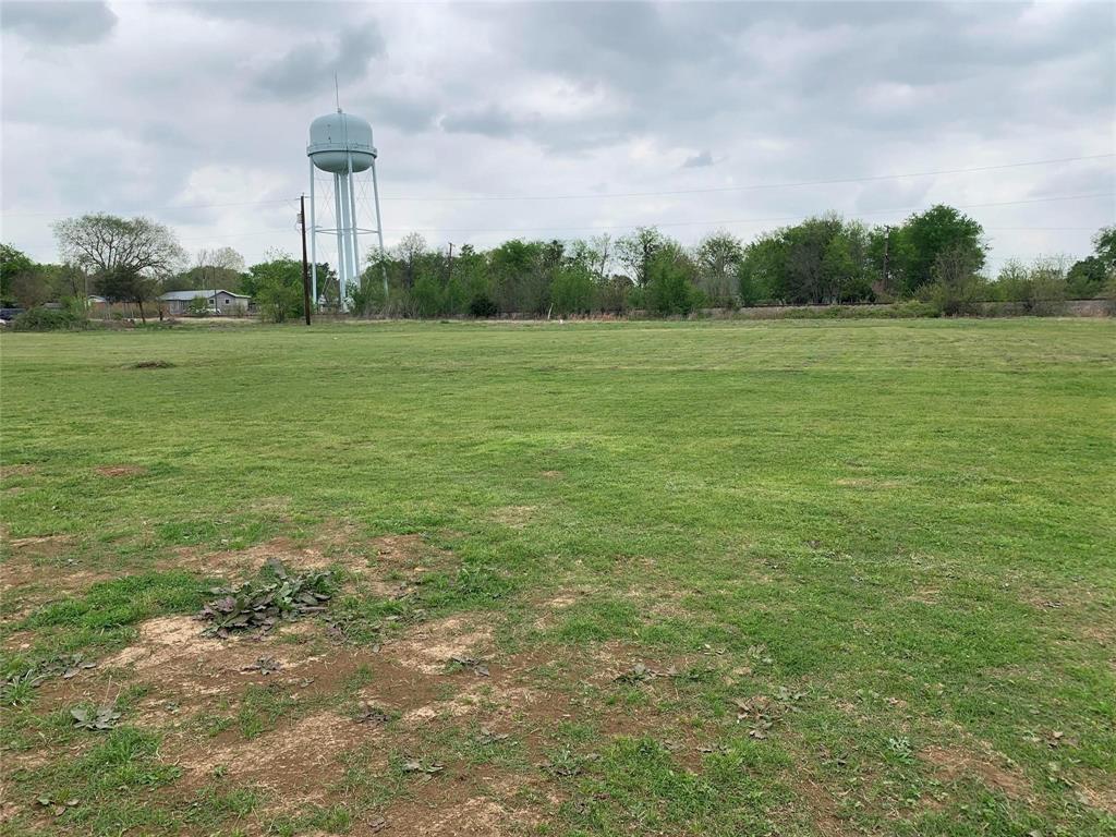 a view of a field with a big yard