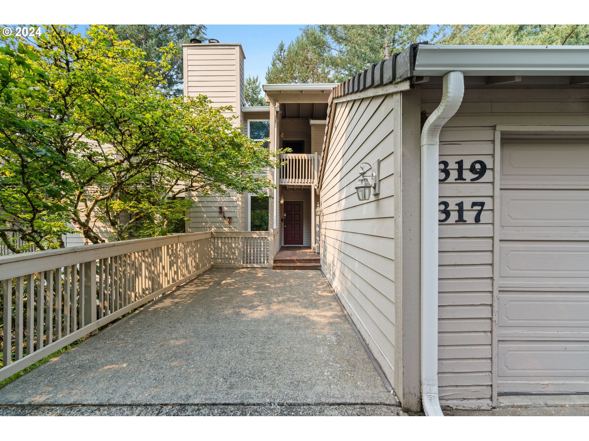 a view of front door and deck of the house