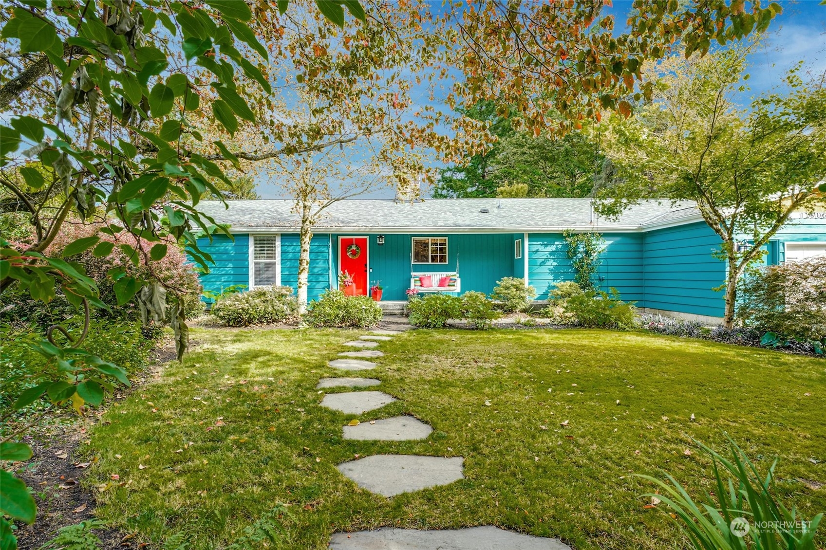 a front view of a house with garden