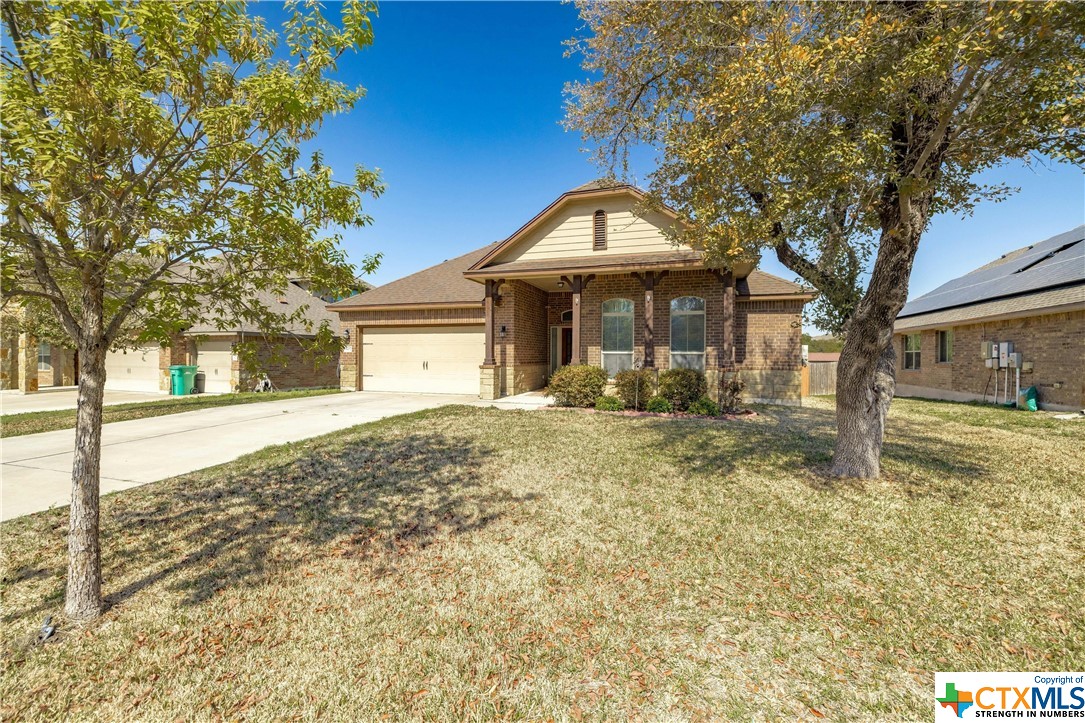 a front view of a house with a yard