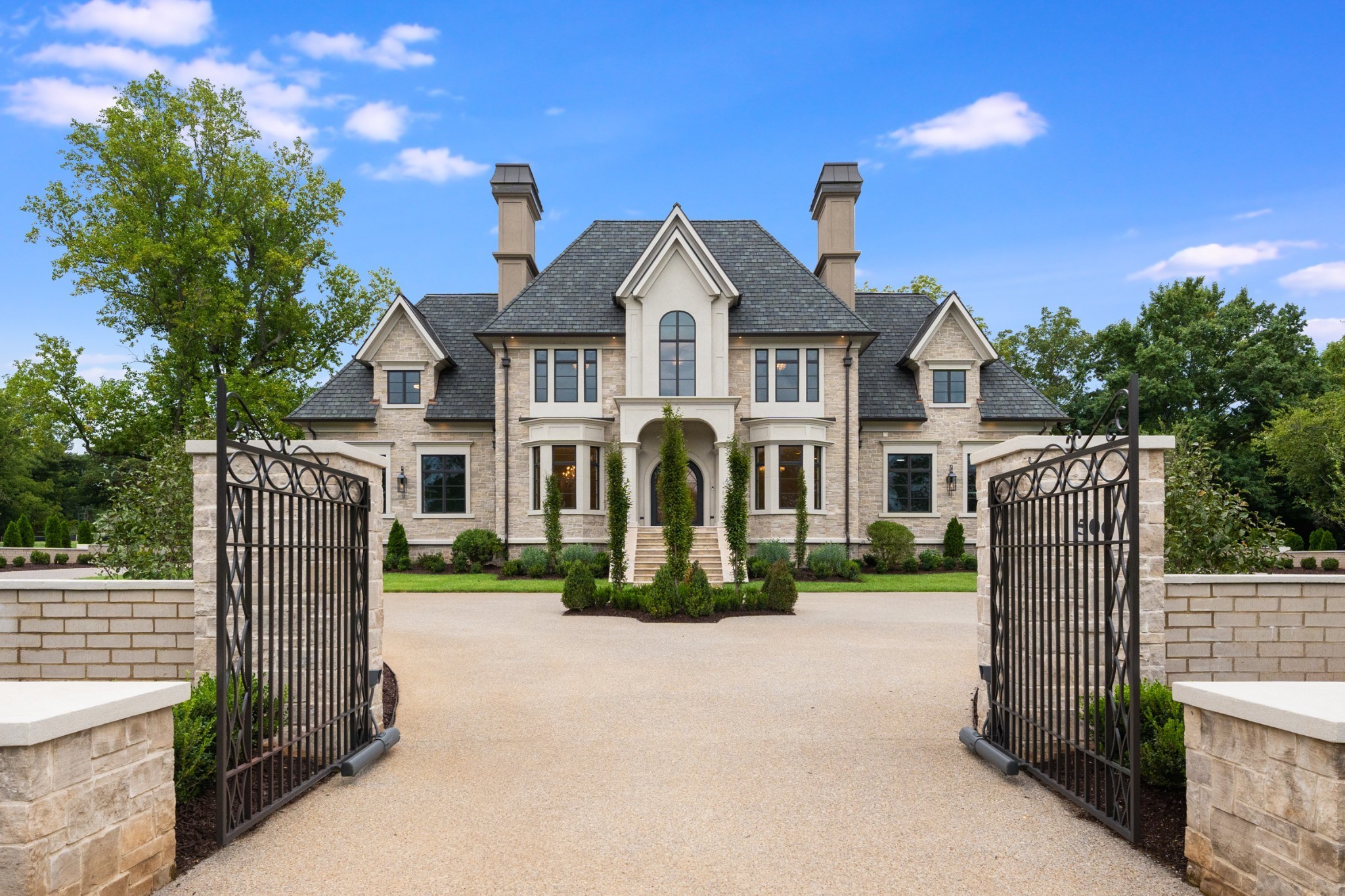 a front view of a house with a yard