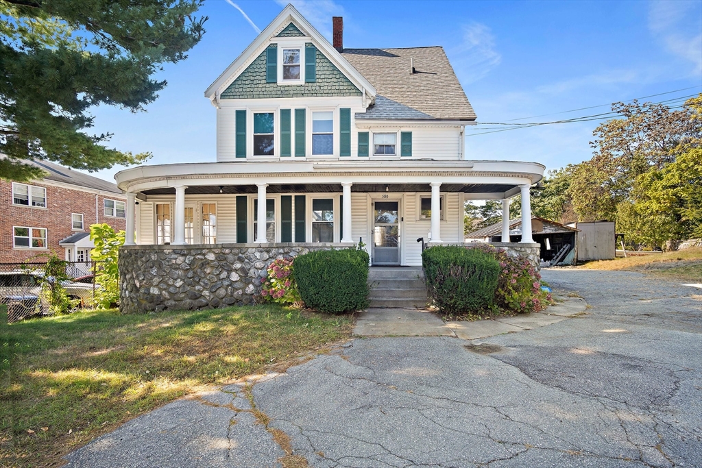 front view of a house with a yard