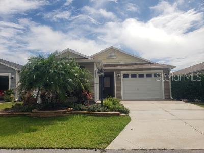 a front view of house with yard and swimming pool