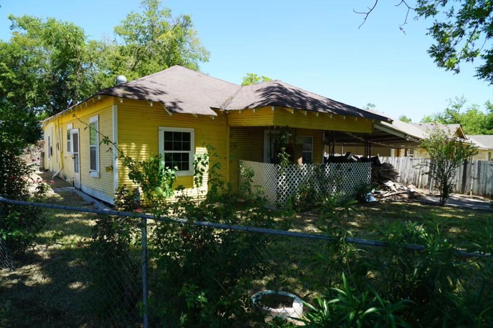 a view of a house with a garden