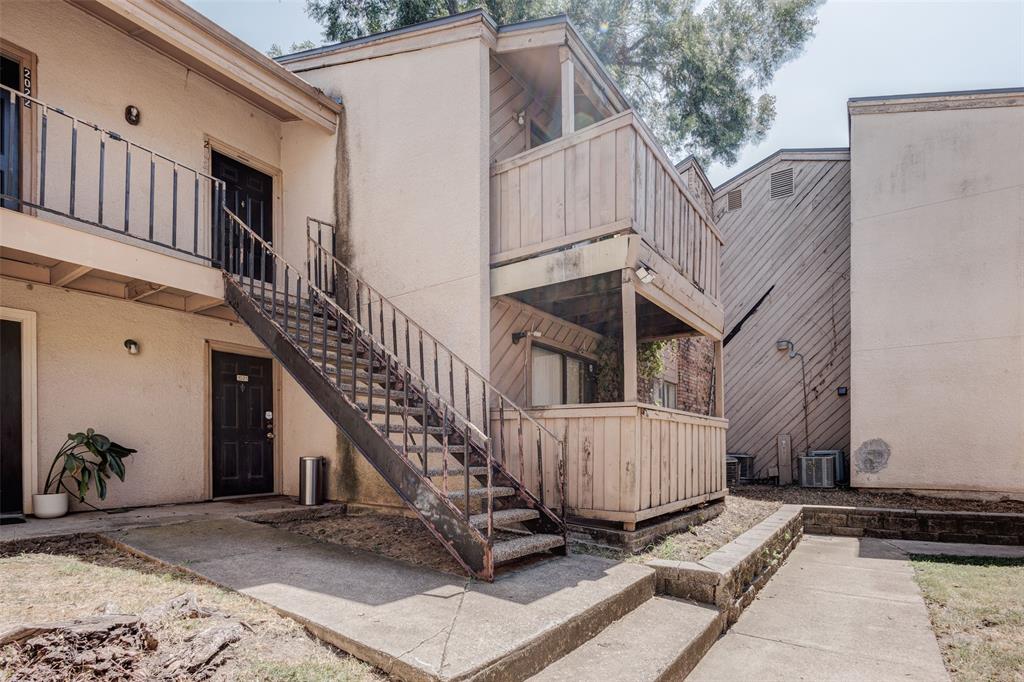 a view of a house with a small yard