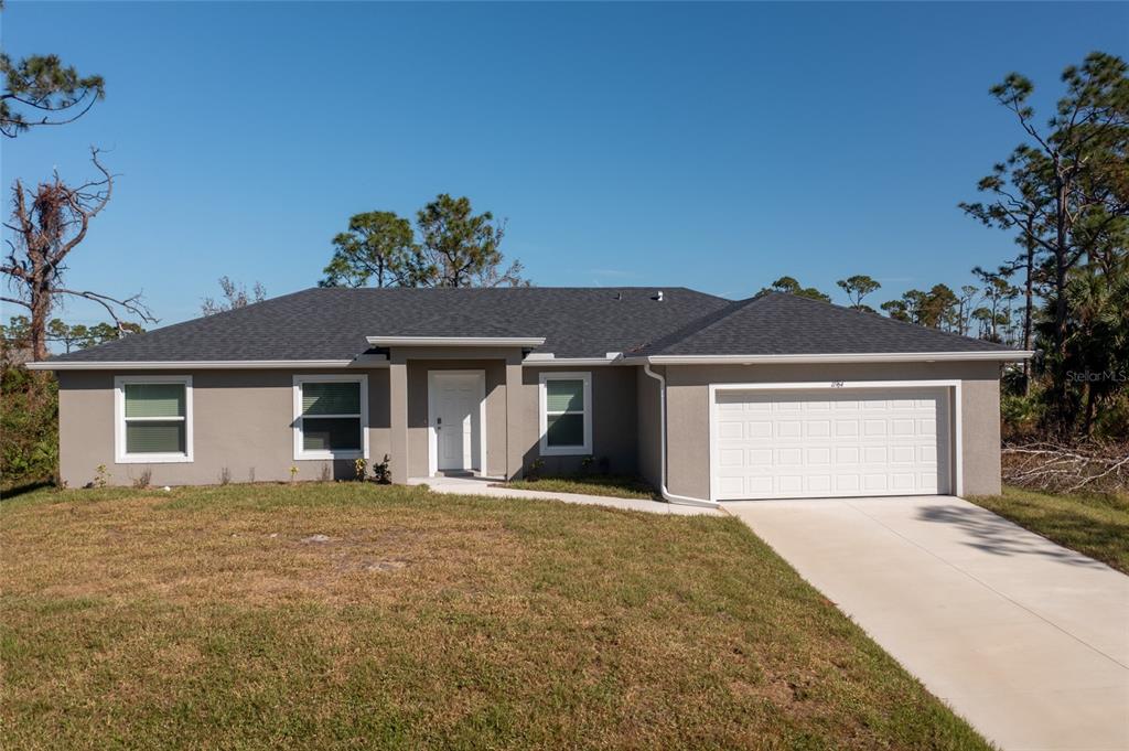 front view of a house with a yard