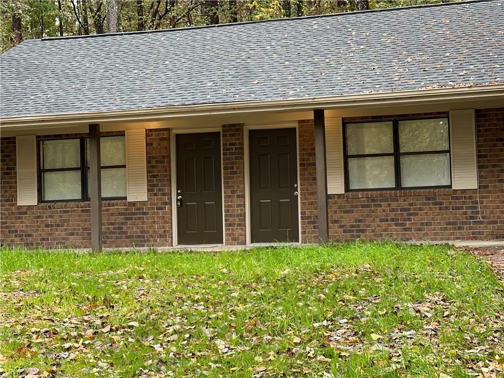 a view of front of a house with a large window