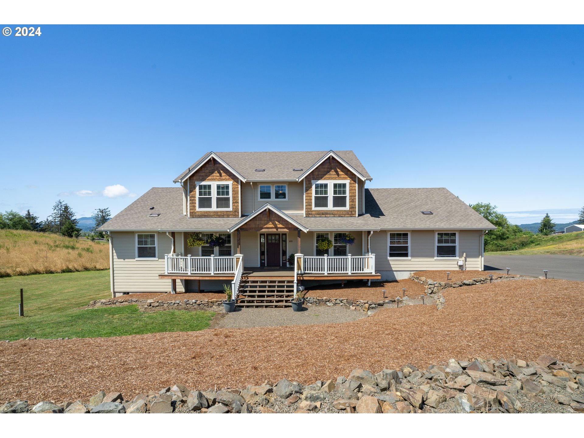 front view of a house with a yard