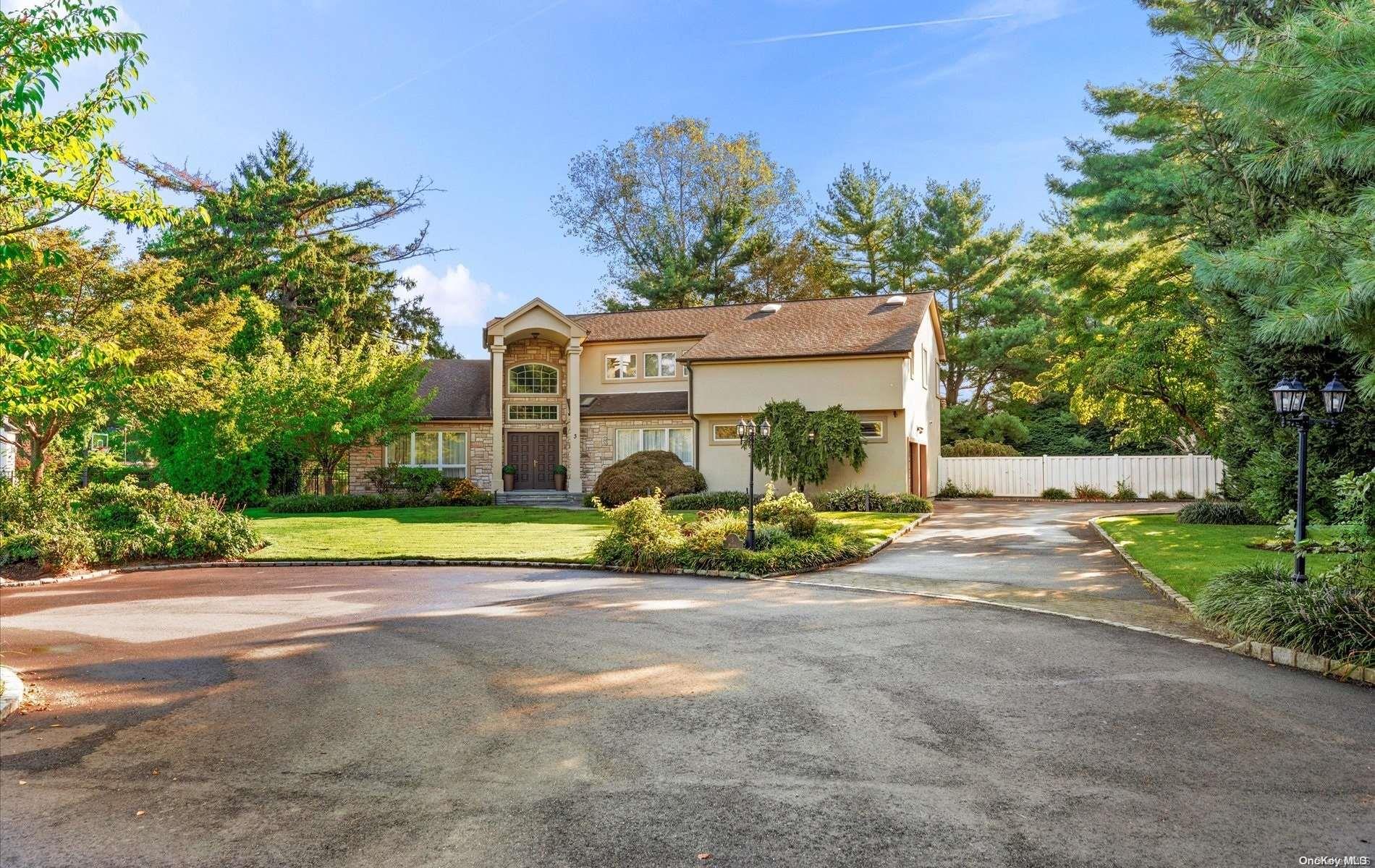 a view of a house with a outdoor space and trees