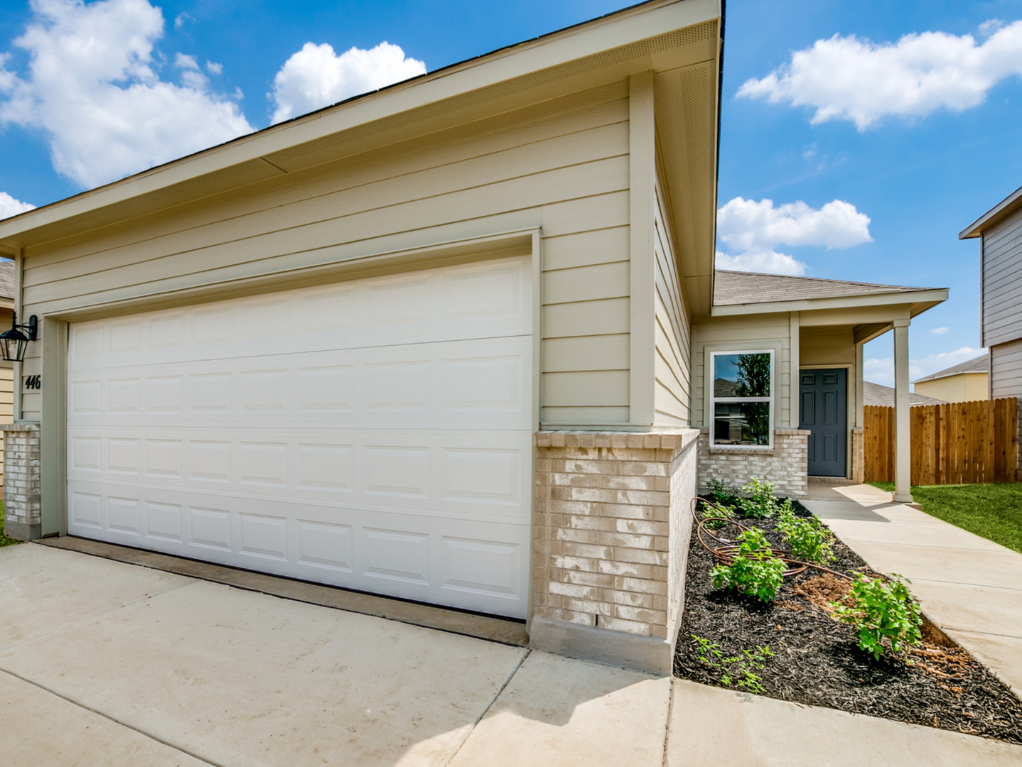 a front view of a house with a garage