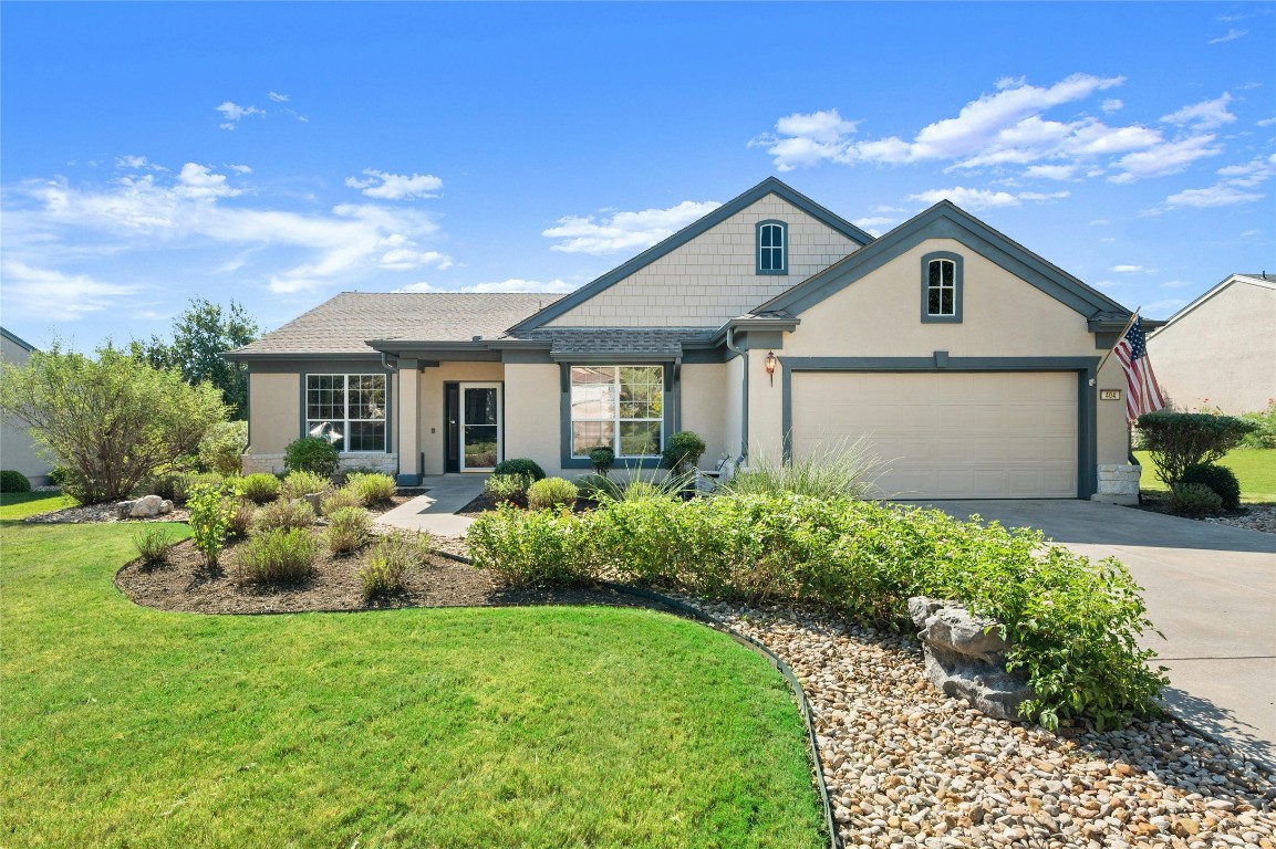 a front view of house with yard and green space