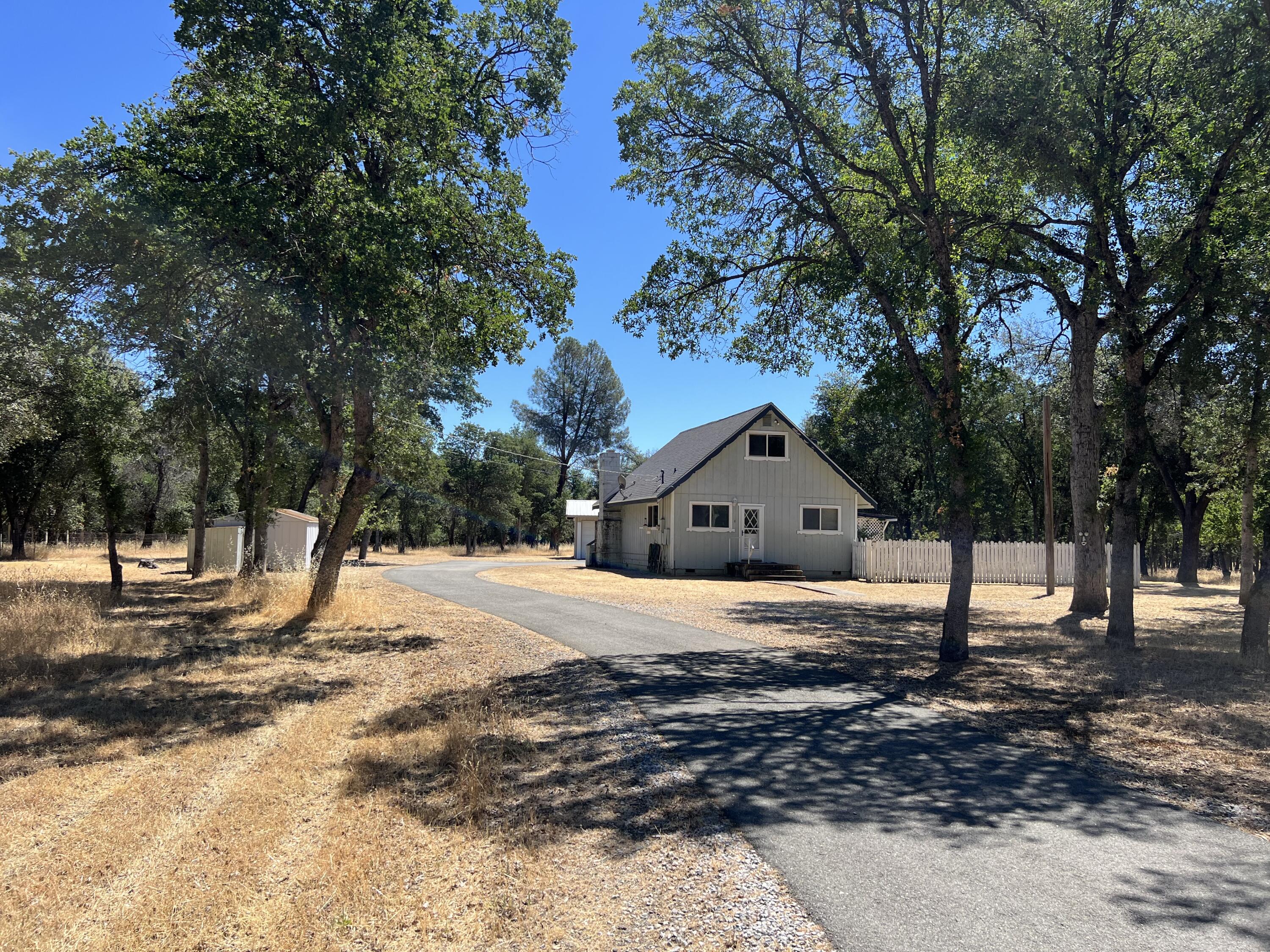 a house with trees in the background