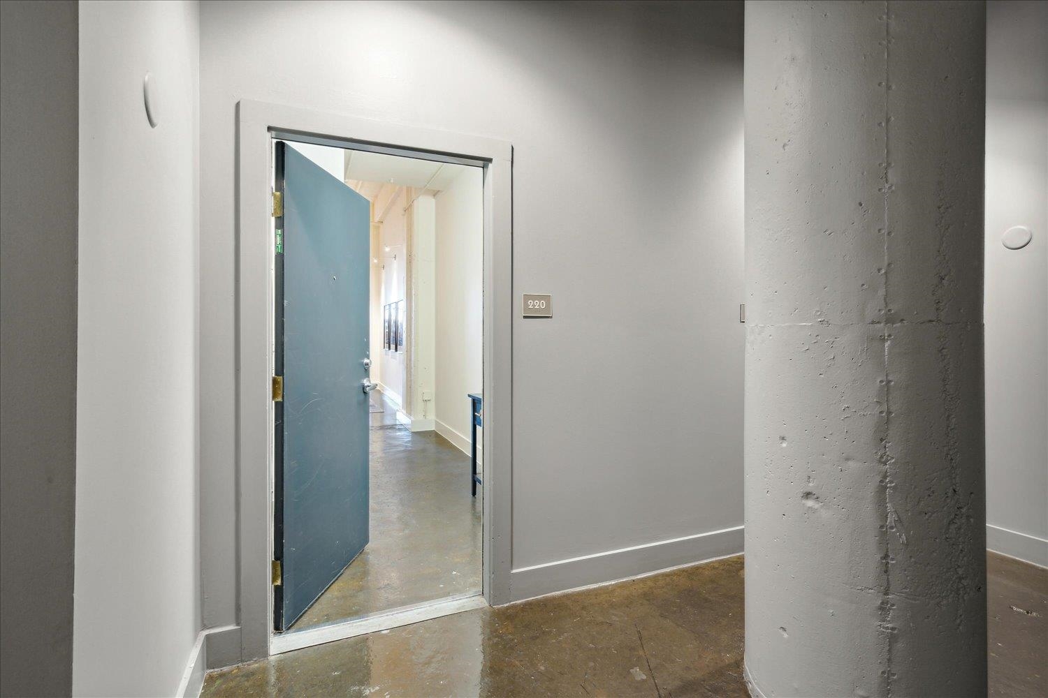 a view of a bathroom from a hallway