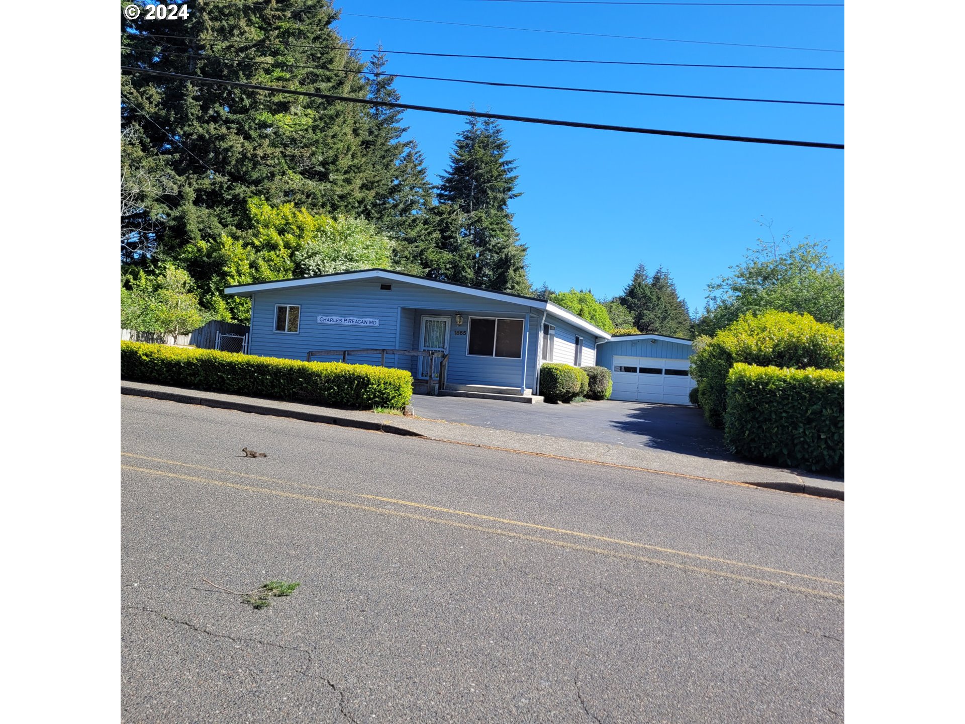 a view of a house with a street