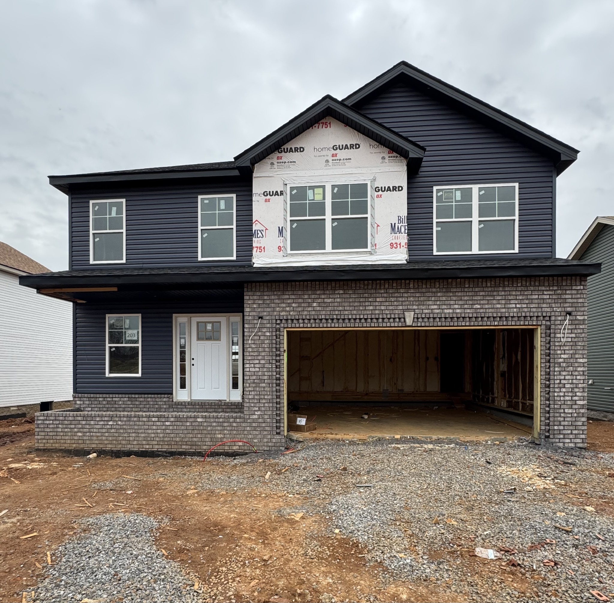 a front view of a house with a garage