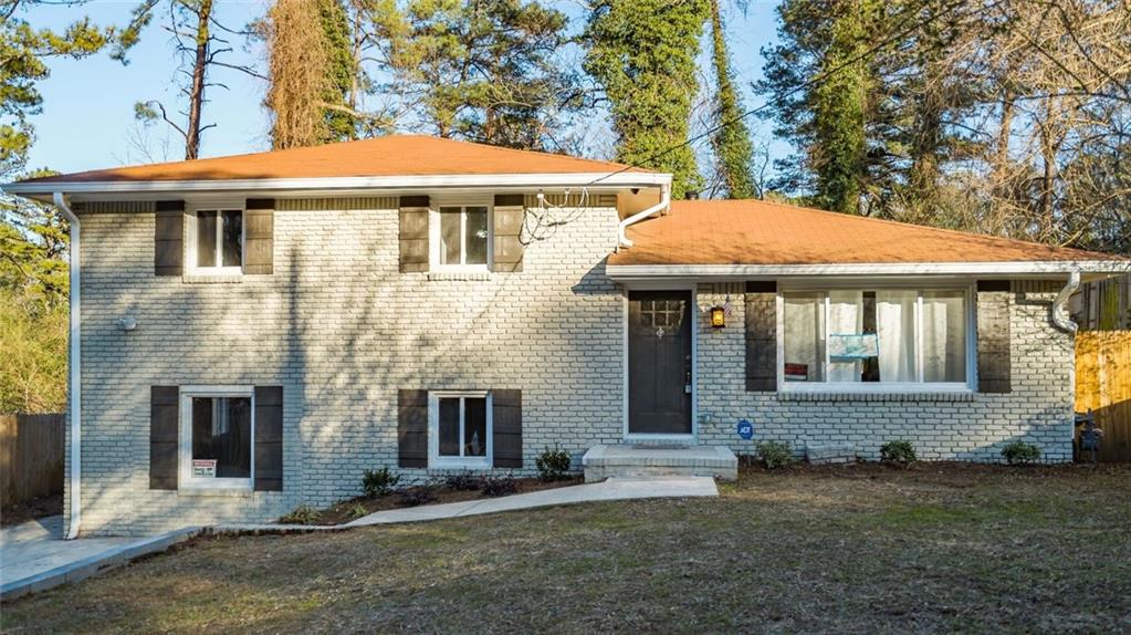 a front view of a house with a yard