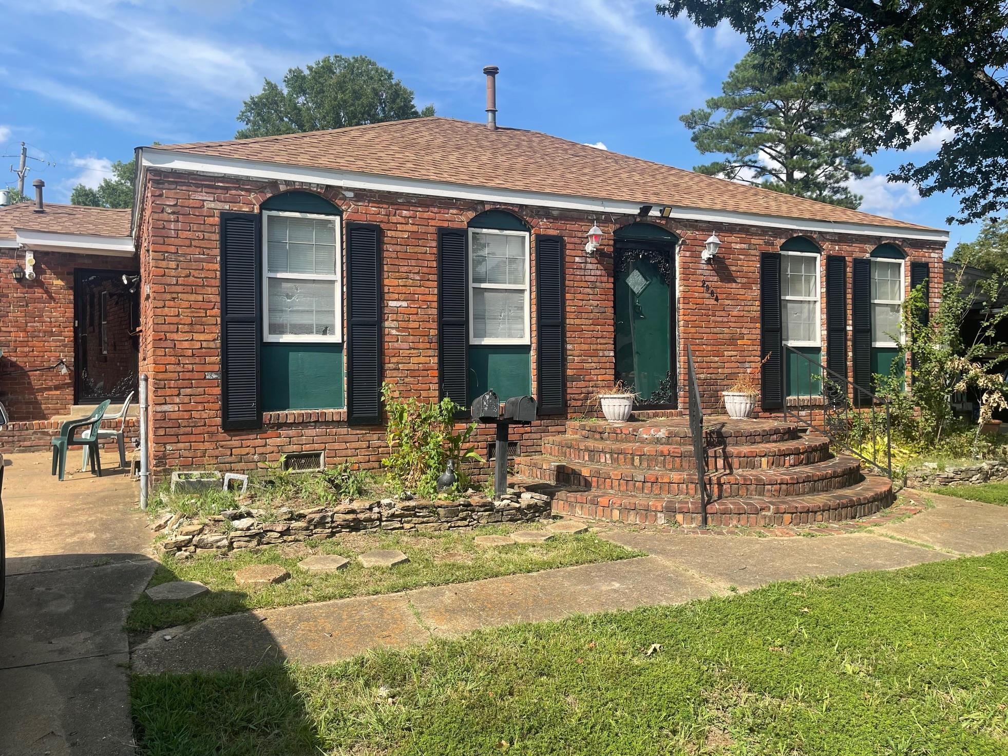 a view of house with yard