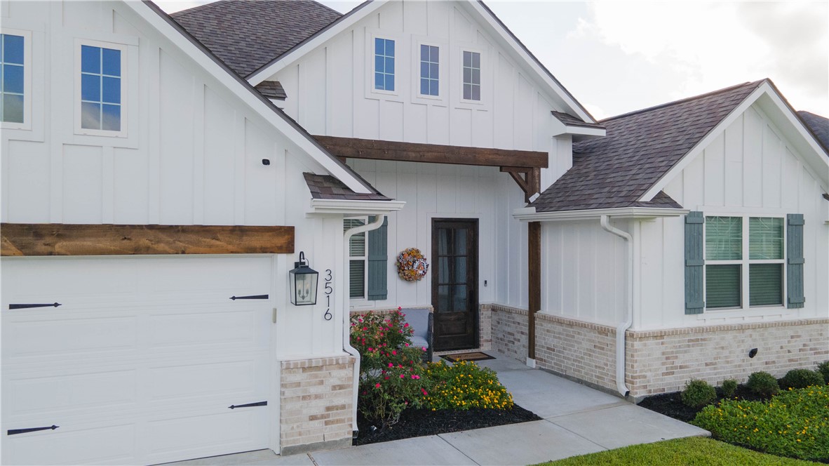 Modern farmhouse style home featuring a garage