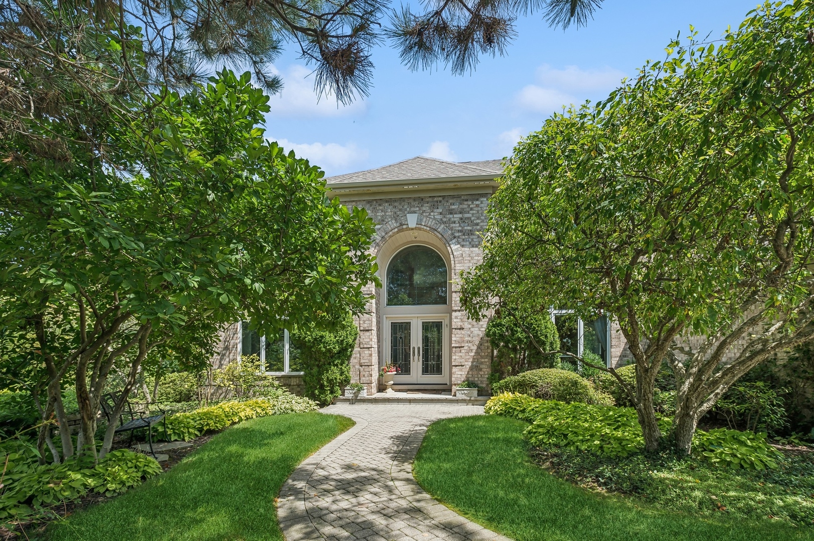 front view of a house with a garden