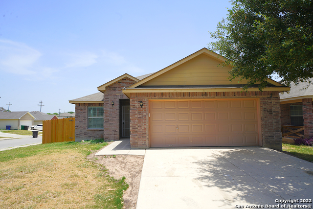 a front view of a house with a garage