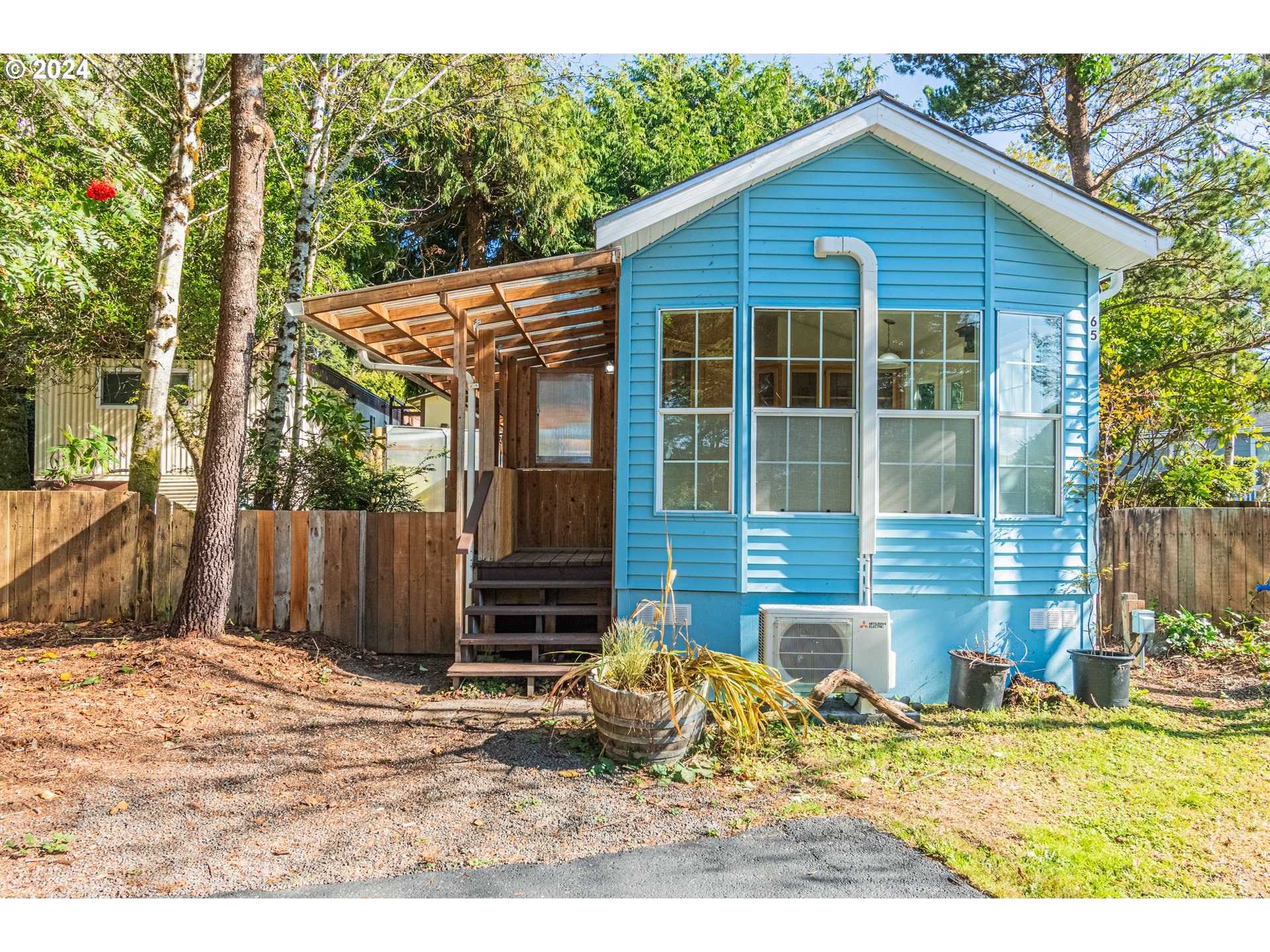 a view of a backyard with a small cabin