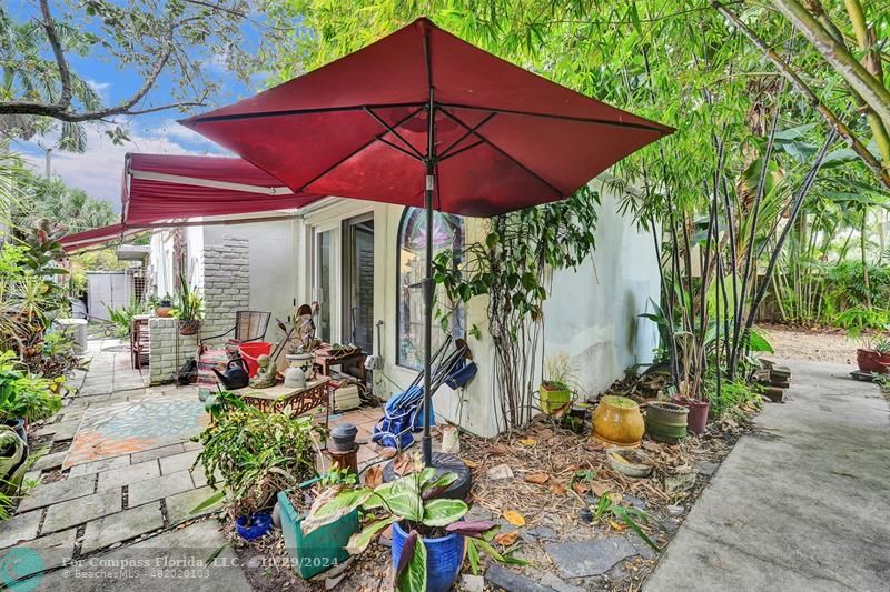 a view of a chair and table in the patio