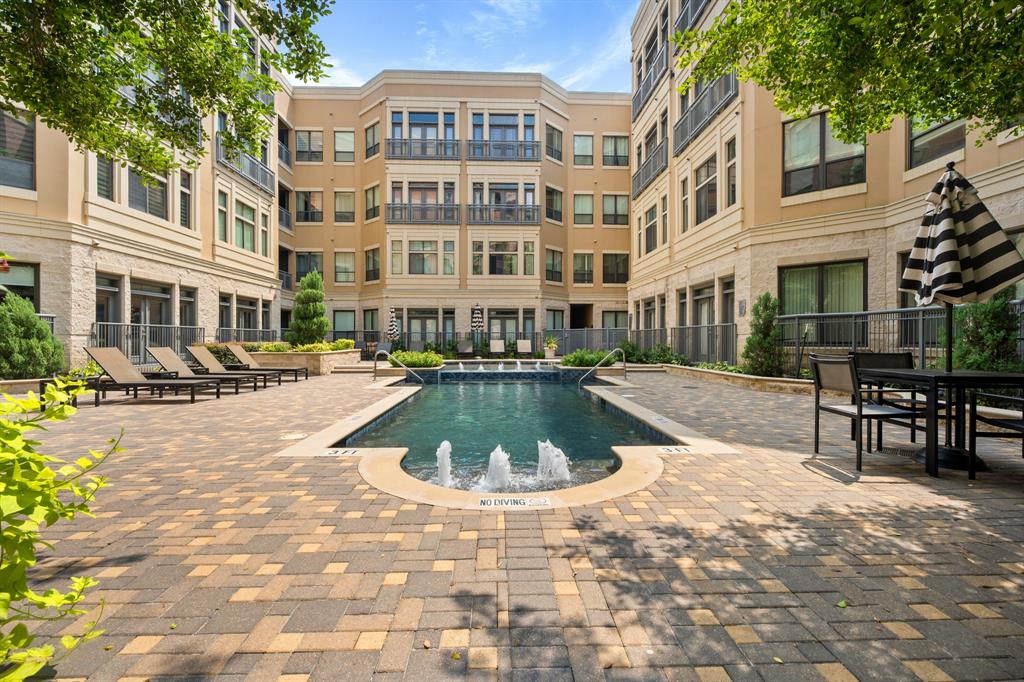 a view of a swimming pool with a lounge chairs