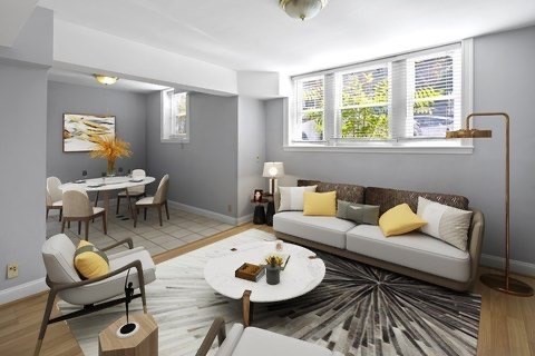 a living room with furniture and a window