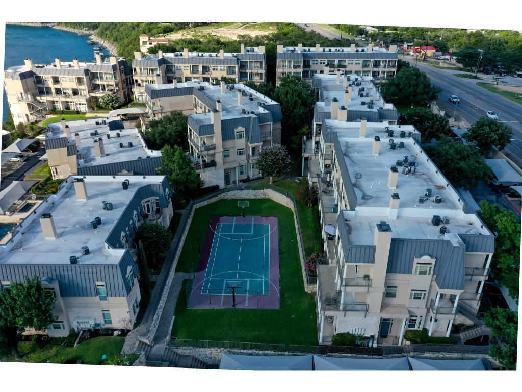 Unit 254's large covered back patio faces out to the corner of the sport court with easy access to the courtyard for a pet to enjoy.