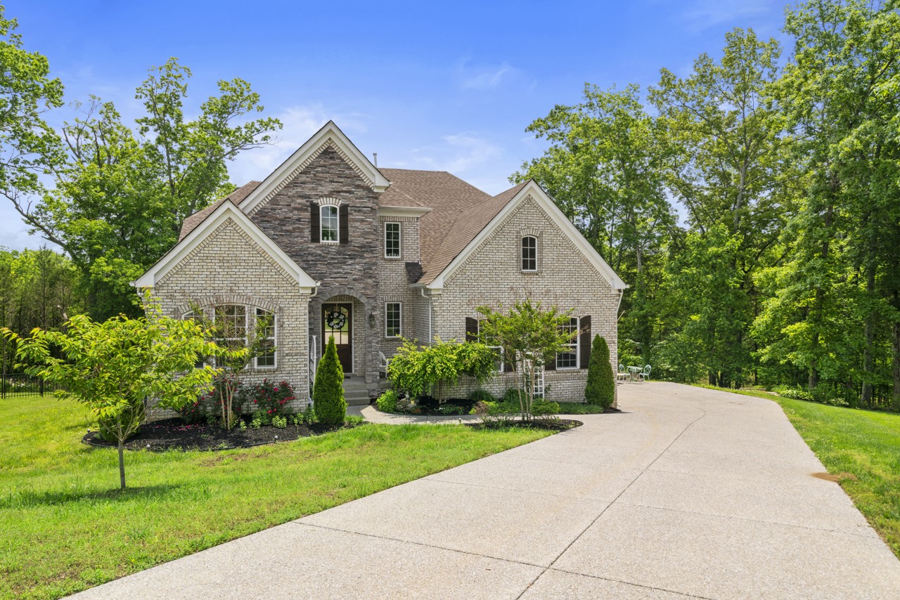 a front view of a house with a yard