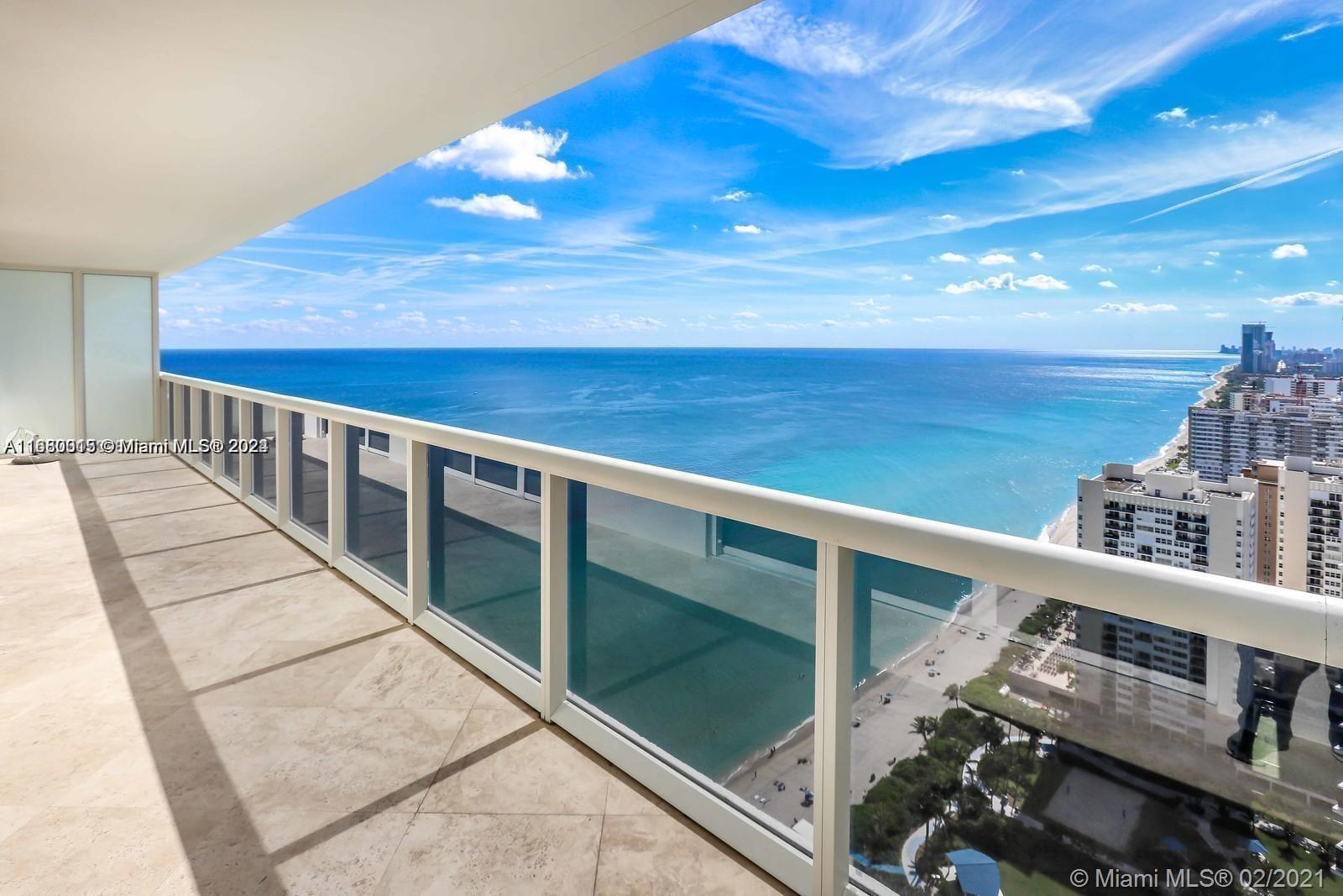 a view of balcony with wooden floor