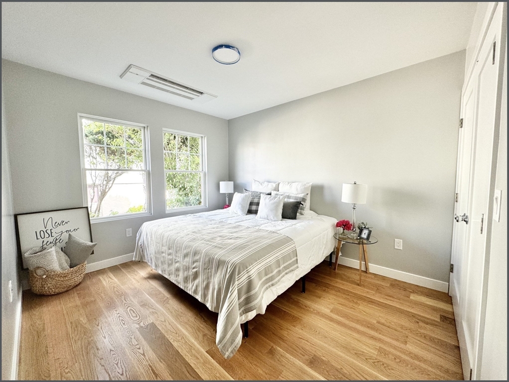 a bedroom with a bed and window