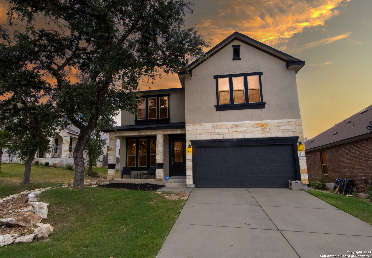 a front view of a house with a yard