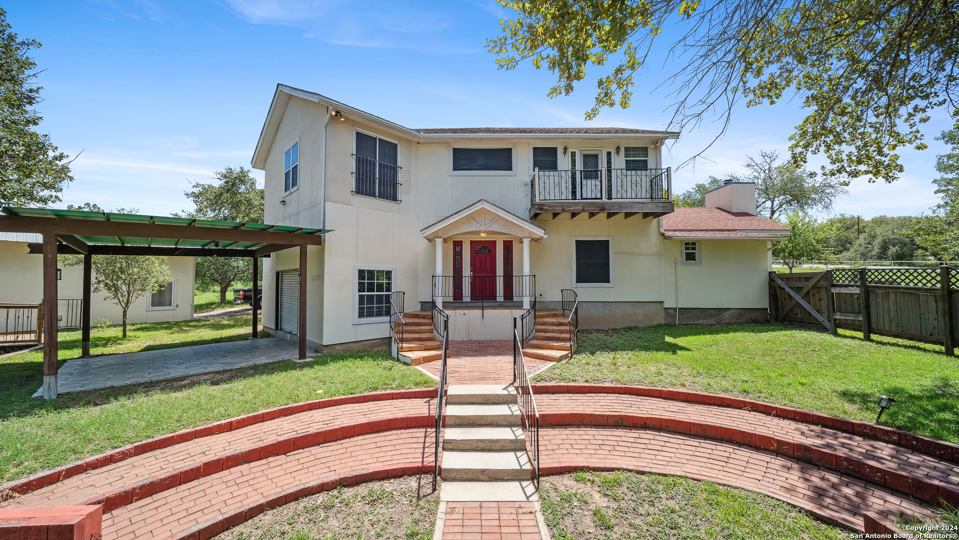 a front view of house with yard patio and green space