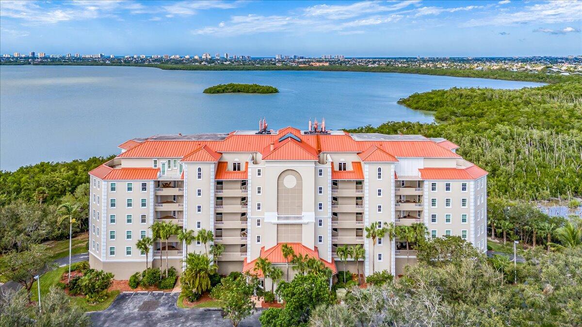 an aerial view of a house with a lake view