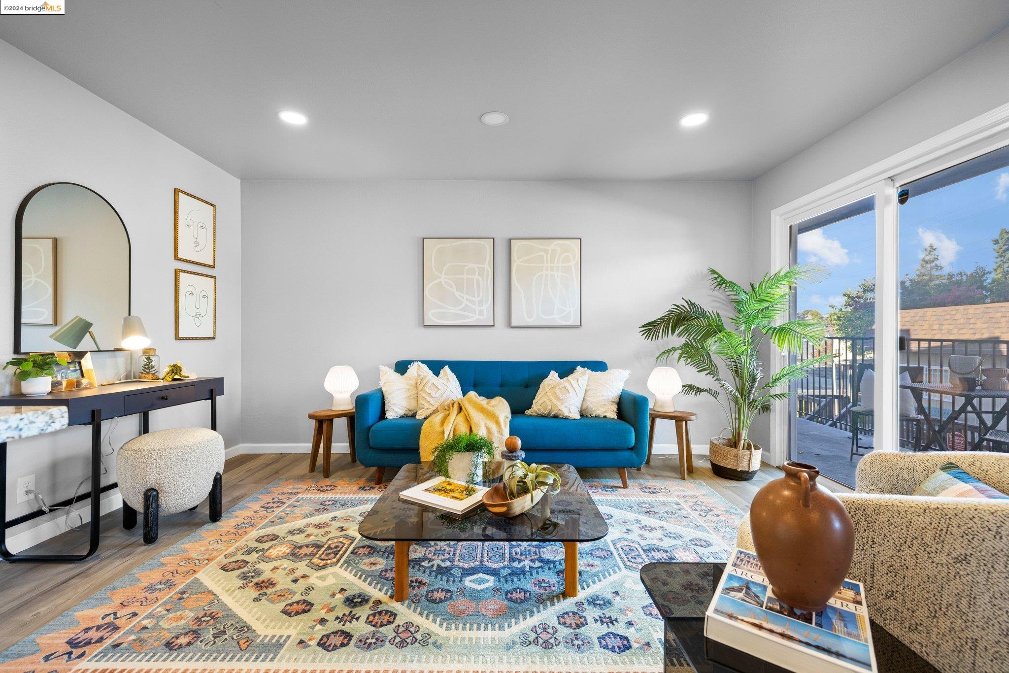 a living room with furniture rug and window