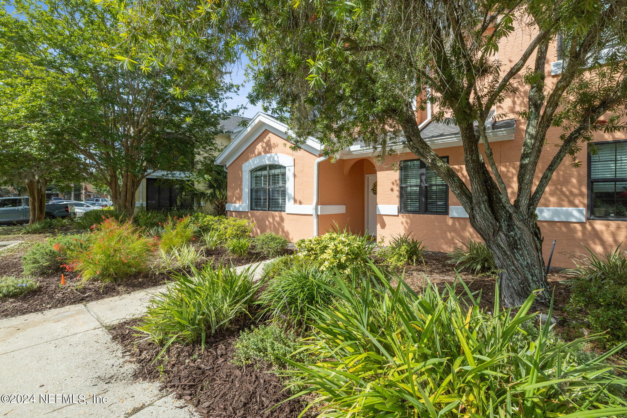 a front view of a house with garden