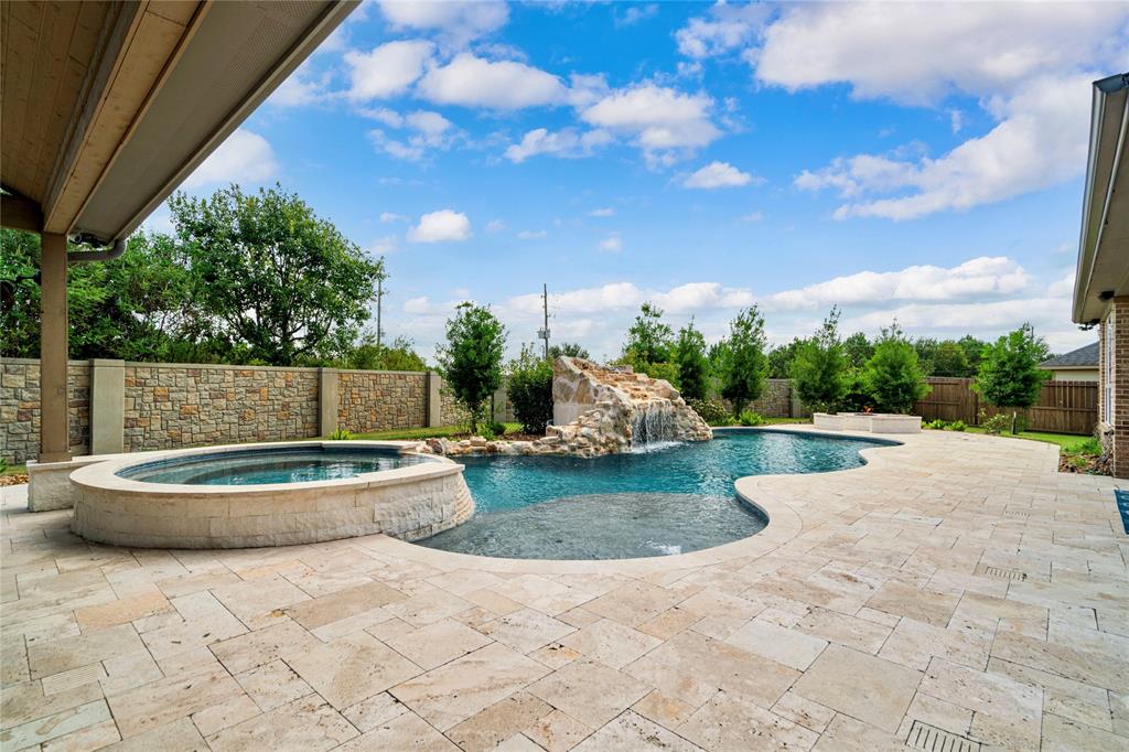 a view of a backyard with sitting area