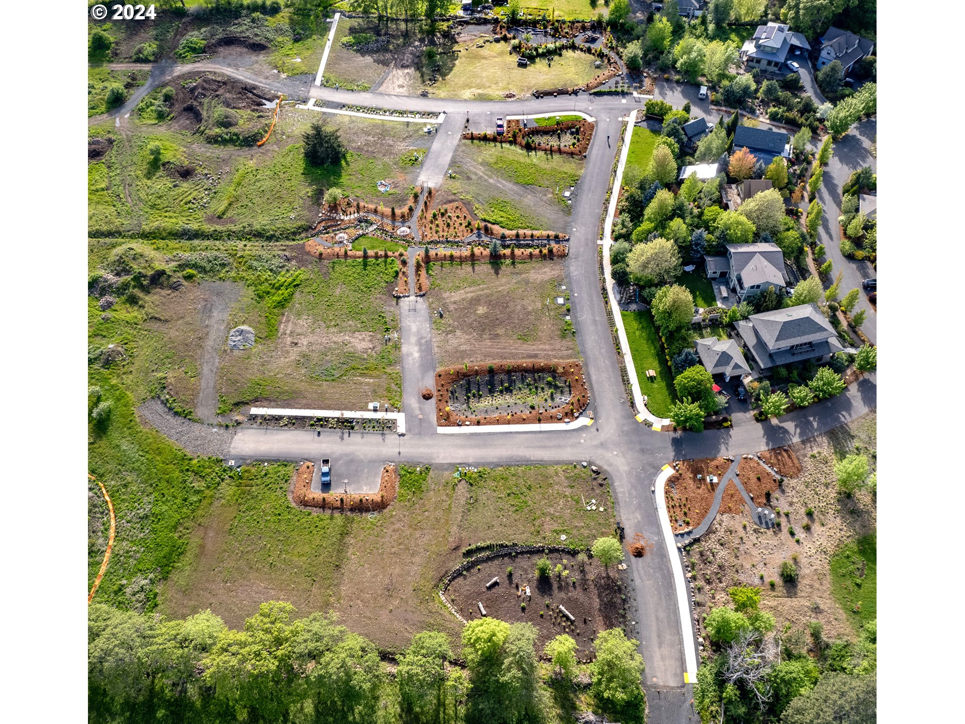 an aerial view of a house with a yard swimming pool