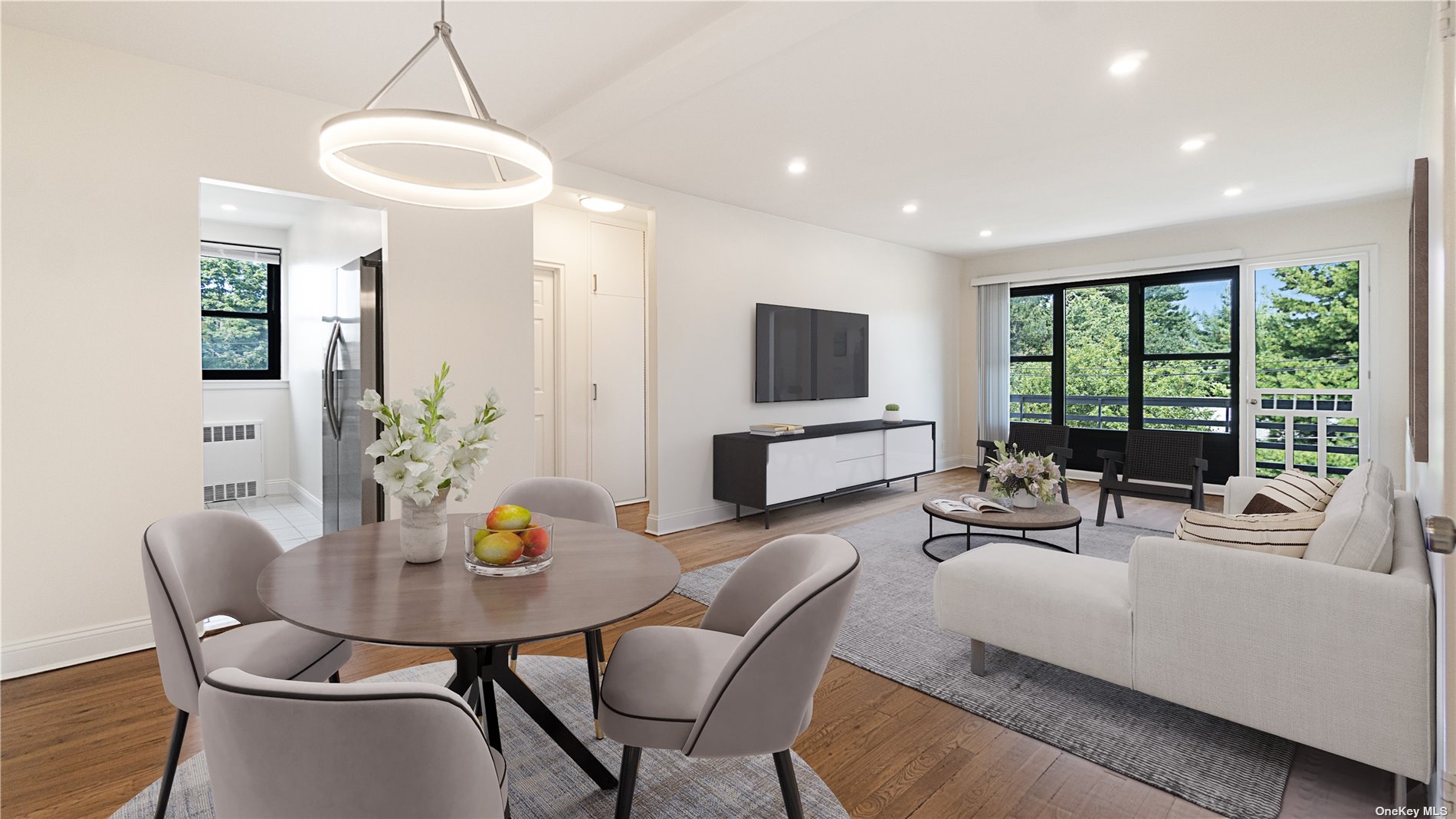 a living room with furniture a flat screen tv and a large window