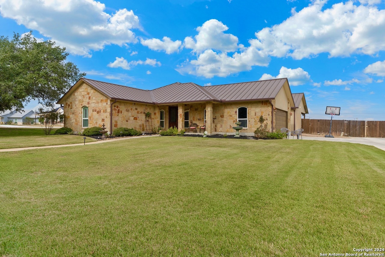 a view of a house with a big yard