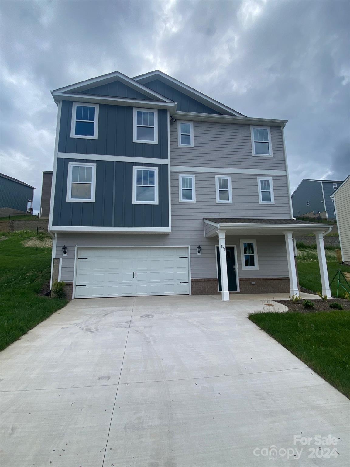 a front view of a house with yard