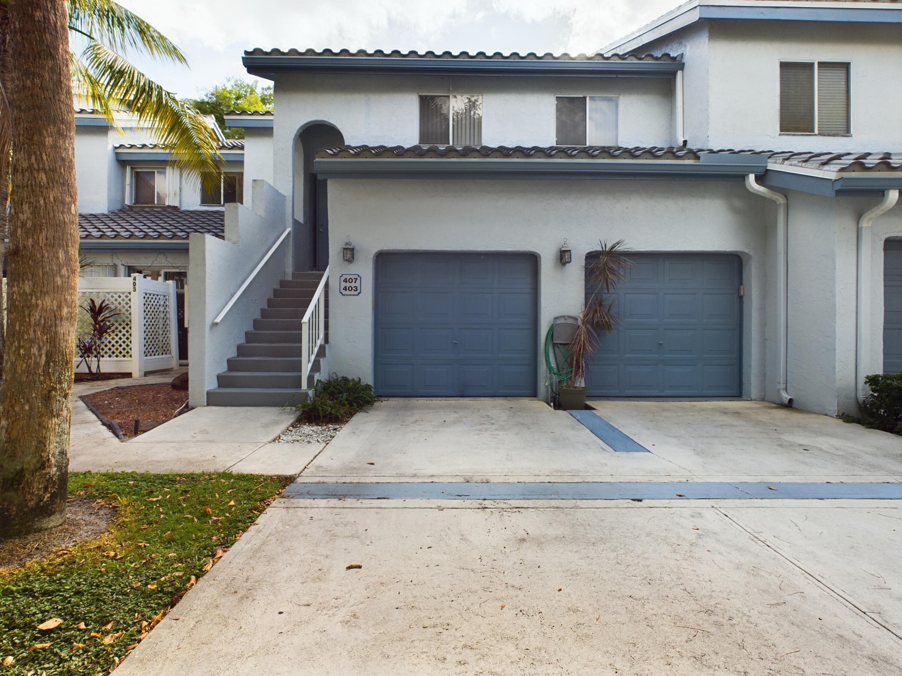 a front view of a house with garage