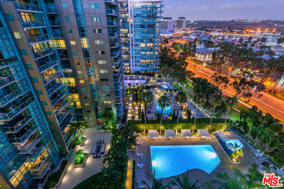 a view of swimming pool with outdoor seating