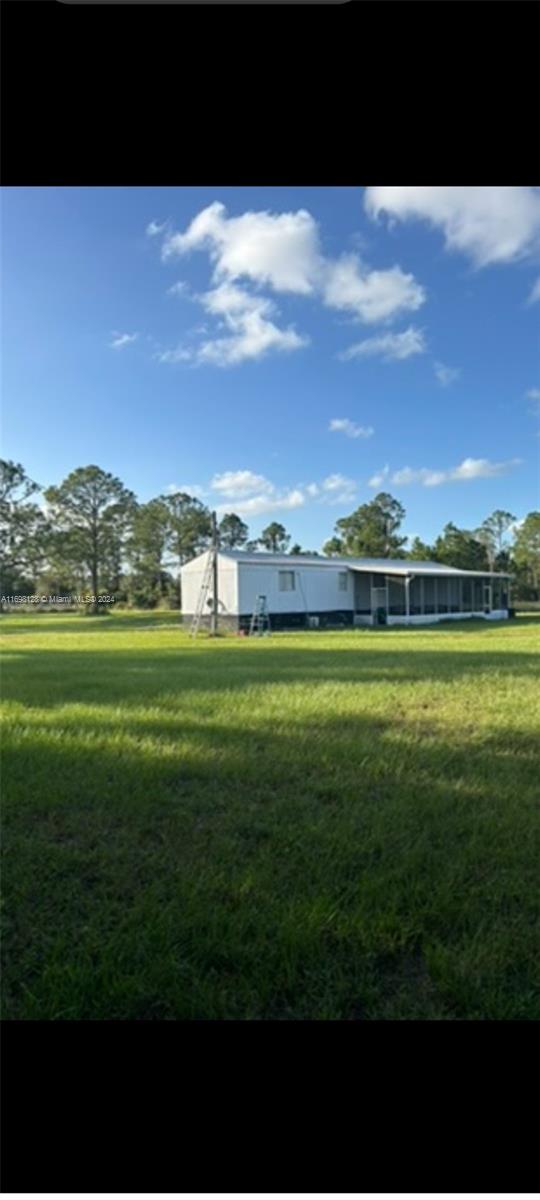 a view of a golf course with a building