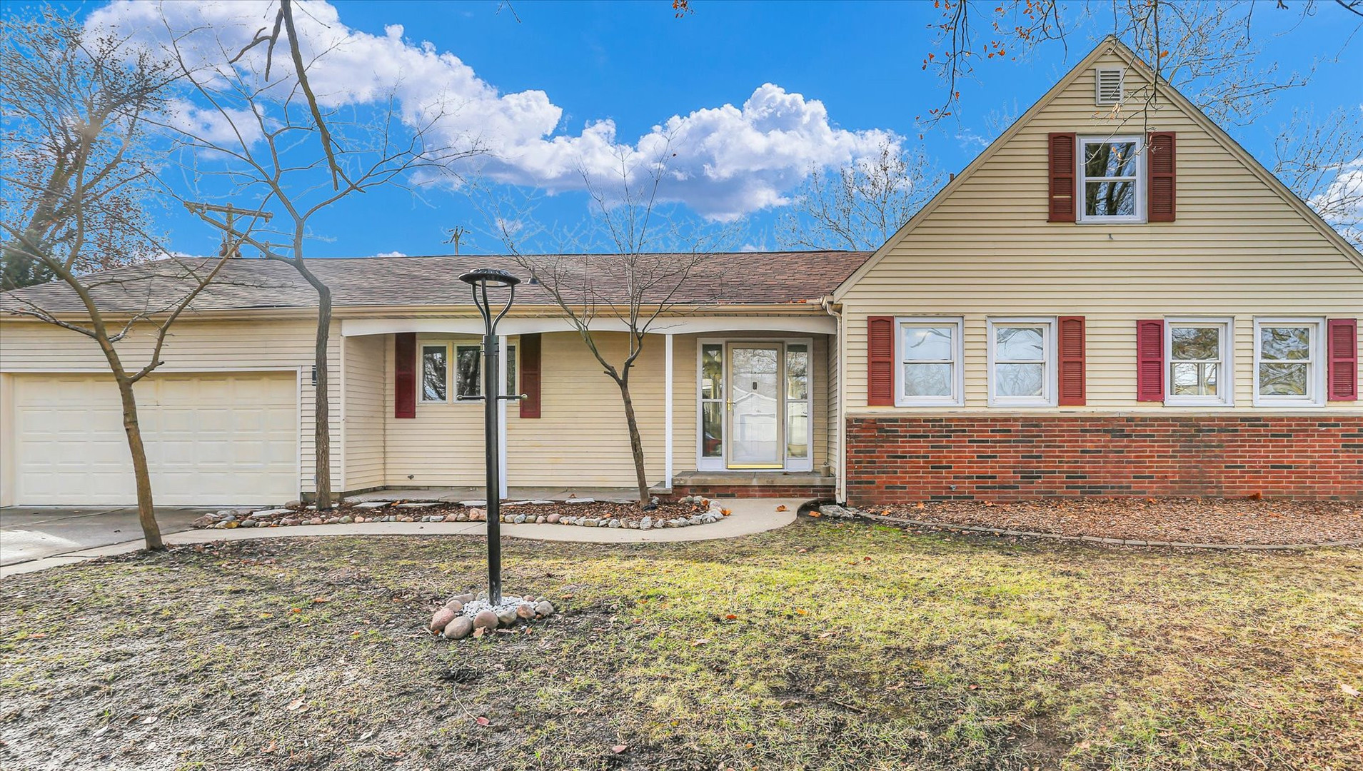 a front view of a house with a yard