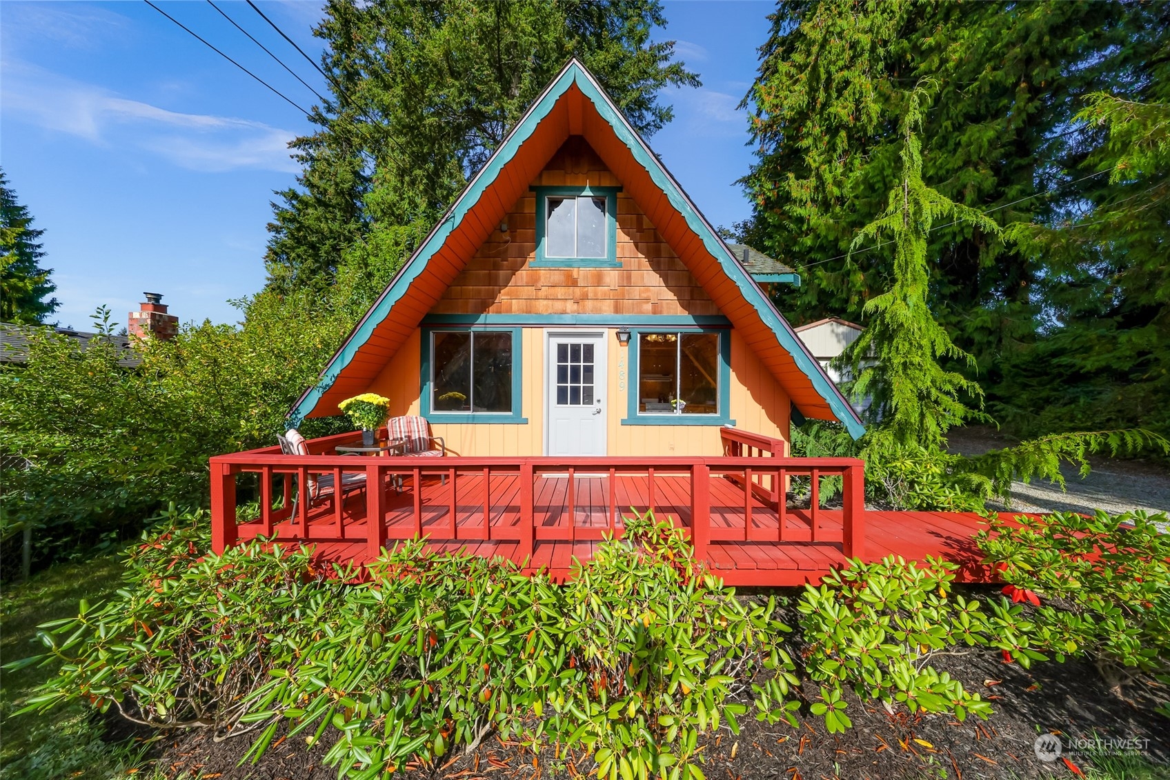 a view of a house with wooden fence